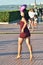 RUSSIA, SAMARA - JULY 21, 2019: girl dancing on the street latin american dancing in carnival head a dress with colorful feathers