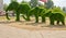 Russia Saratov region August 28, 2018: sculptures green elephants from the lawn
