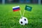 Russia - Saudi Arabia, Group A, Thursday, 14. June, Football, 2018, National Flags on green grass, white football ball on ground.