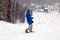 Russia, Sheregesh 2018.11.18 Professional man snowboarder in bright sportswear and outfit skiing downhill in snowy sunny high