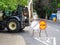 Russia, Sochi 01.07.2020. Traffic signs are on the marked road next to the excavator. Repair work on the road