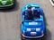 Russia, Sochi 16.04.2021. A little boy drives a blue miniature car with the inscription lukoil on a children\'s race