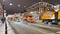 Russia, St. Petersburg, 01 January 2022: Several snowplows simultaneously clean the main street from it, bright festive