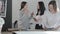 Russia, St.Petersburg, 01 March 2019: Three fashion designer works at sew studio, girls discuss about something and