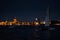 Russia, St. Petersburg, 07 August 2022: A few sailboats with sails illuminated in the tricolor of Russia go in the city