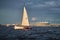 Russia, St. Petersburg, 23 July 2021: Competition of sailboats on the horizon in sea at sunset, the amazing storm sky of