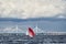 Russia, St. Petersburg, 23 July 2021: Competition of sailboats on the horizon in sea at sunset, the amazing storm sky of