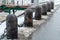 Russia, St. Petersburg, January 2021. Granite posts with anchor chains on the embankment.