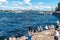 Russia, St. Petersburg, July 2020. People resting on a small beach in the center and a view of the Neva River.