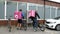 Russia, St. Petersburg - June 2020. Bicycle parking for couriers. Courier food delivery man in medical mask rides a bicycle.