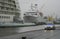 Russia, St. Petersburg, Lieutenant Schmidt embankment, port, pier, white liners close-up, gray car. A gray cloudy day.