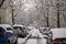 Russia, St. Petersburg - March 10, 2023: Snow-covered cars in the winter yard