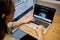 RUSSIA, ST.PETERSBURG - March 5: A girl browses an Apple site on a macbook. Looking for an iPhone