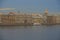 Russia, St. Petersburg, Neva River embankment, water, embankment architecture. Gentle blue sky. Soft warm daylight. The golden dom