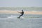 Russia, stanitsa Dolzhanskaya - September 22, 2014; An athlete is engaged in kiting on a windy day in rough coastal sea waves.