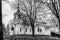 Russia, Tikhvin, December 2020. Black and white photo of the main cathedral of the rural monastery.