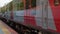 Russia Tuapse 08.08.2021 Red commuter train travels by rail