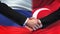 Russia and Turkey handshake, international friendship relations, flag background