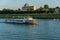 Russia, Tver region, August 2018. A small tourist ship with passengers sails past the pier in Tver