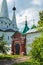 Russia, Uglich, July 2020. A fragment of the monastery wall with a gate and a view of the cathedral.