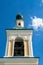 Russia, Uglich, July 2020. Fragment of the multi-tiered bell tower of the Orthodox cathedral against the blue sky.