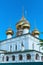 Russia, Uglich, July 2020. The golden domes of the five-domed cathedral against the blue sky.