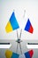 Russia and Ukraine flags on negotiation table close up