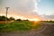 Russia village sunset spring bright sun road poles and wires