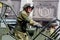 Russia, Vladivostok, 05/09/2018. Soldier in combat uniform riding military vehicle on the parade on Victory Day on May`9. Holiday