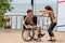 Russia, Vladivostok, 06/12/2018. Actor in wheelchair and usual actor perform the dance on stage. Annual celebration Russia Day on