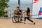 Russia, Vladivostok, 06/12/2018. Actor in wheelchair and usual actor perform the dance on stage. Annual celebration Russia Day on