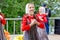 Russia, Vladivostok, 06/12/2018. Portrait of young adorable girl weared in traditional Russian Slavic clothes. Performance on