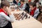 Russia, Vladivostok, 12/01/2018. Kids play chess during chess competition in chess club. Education, chess and mind games.