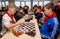 Russia, Vladivostok, 12/01/2018. Kids play chess during chess competition in chess club. Education, chess and mind games.