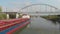 Russia. Volgograd. Volga-Don Shipping Channel. Cargo transportation by water. The cargo ship is berthed under the railway bridge w