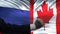 Russia vs Canada confrontation, countries disagreement, fists on flag background