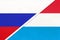 Russia vs Luxembourg national flag from textile. Relationship and partnership between two countries