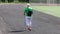 Russia Vyborg. 05.05.2021 Elderly woman engaged in Scandinavian walking in the stadium