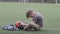 Russia. Vyborg. 05.05.2021 Frustrated boy sits in goal on football field
