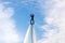 Russia. Vyborg. 05.09.2020. A man flies on a FlyBoard against the background of the sky with clouds. Extreme sport