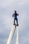 Russia. Vyborg. 05.09.2020. A man flies on a FlyBoard. vertical frame