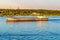 Russia, Yaroslavl, July 2020. Large cargo barge on the river at sunset.