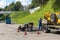 Russia, Yaroslavl, July 2020. Workers on the embankment repair the sewer system.