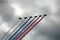 Russian attack aircraft SU-25, planes with colored contrail. Colors of Russian flag