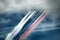 Russian attack aircraft SU-25, planes with colored contrail. Colors of Russian flag