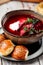 Russian beetroot soup borscht with beets and buns