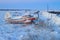 Russian biplane aircraft near the old Northern airfield in the tundra among the snow and bushes.