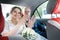 Russian bride and groom in the car