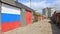 Russian - Chinese flags on garage doors in garage colony in the suburbs
