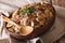 Russian cuisine: buckwheat porridge with mushrooms close-up. horizontal